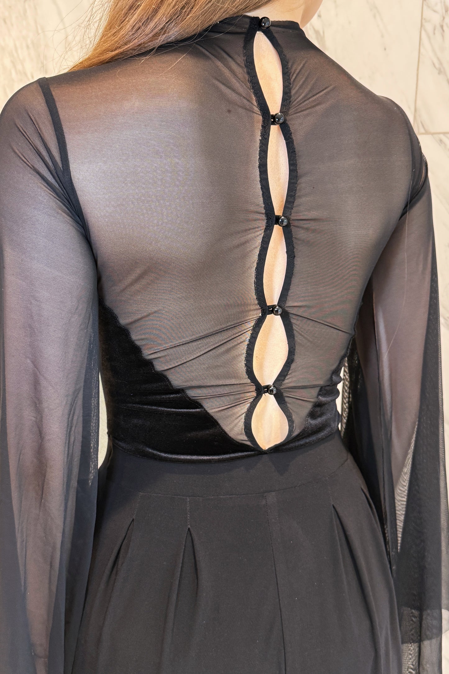 Black velvet leotard with net wings