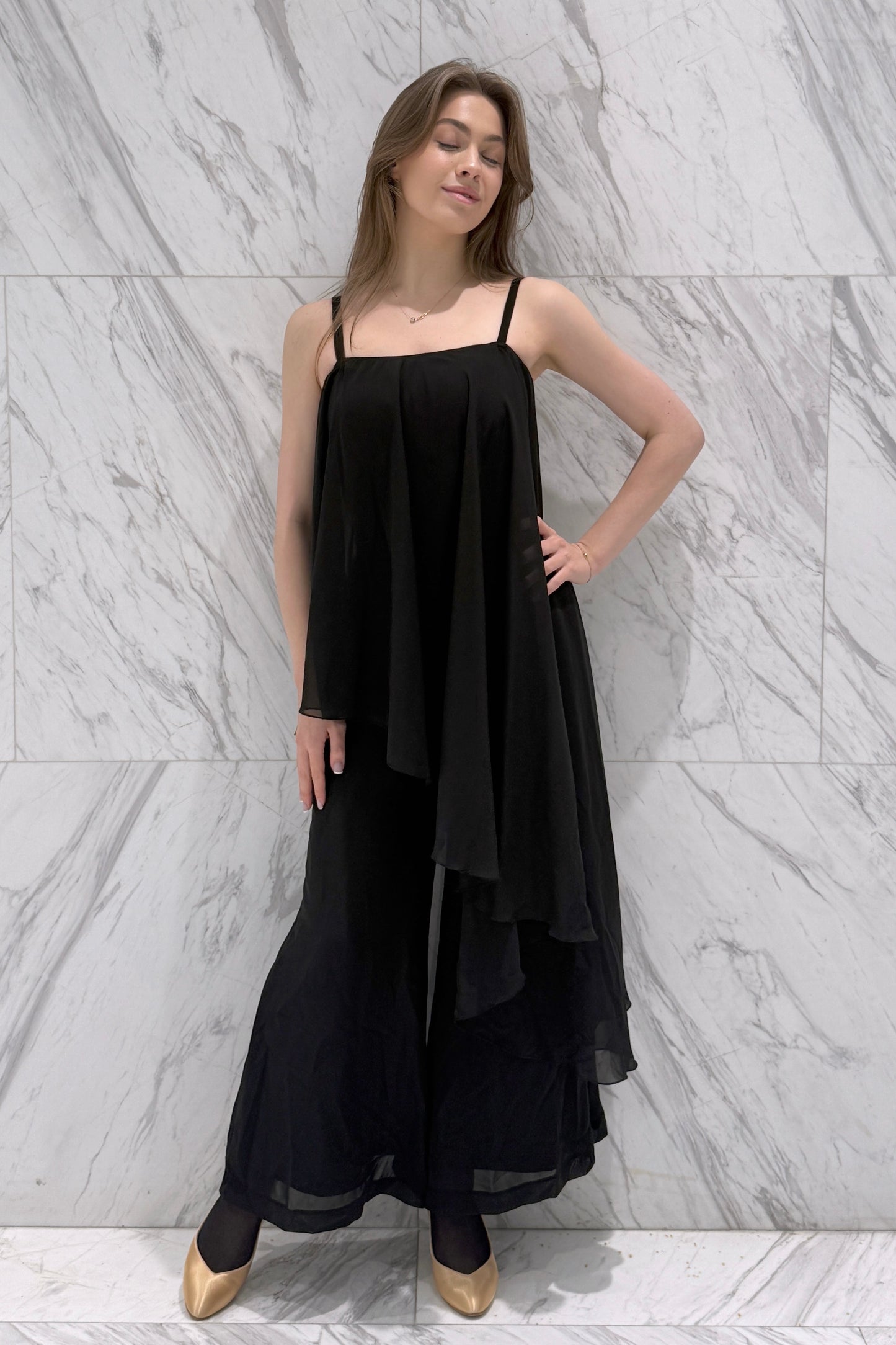 Jumpsuit with an asymmetrical top