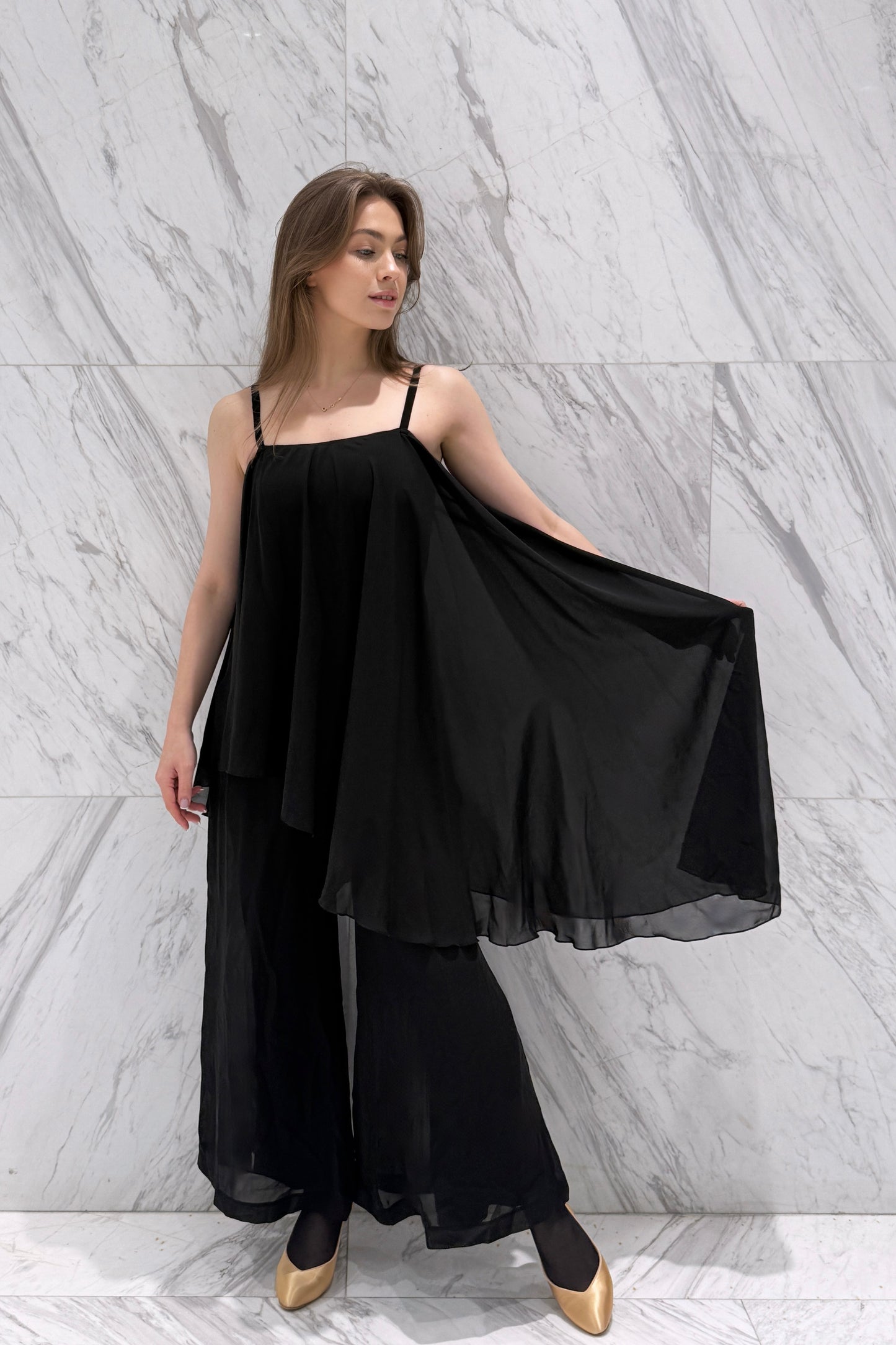Jumpsuit with an asymmetrical top