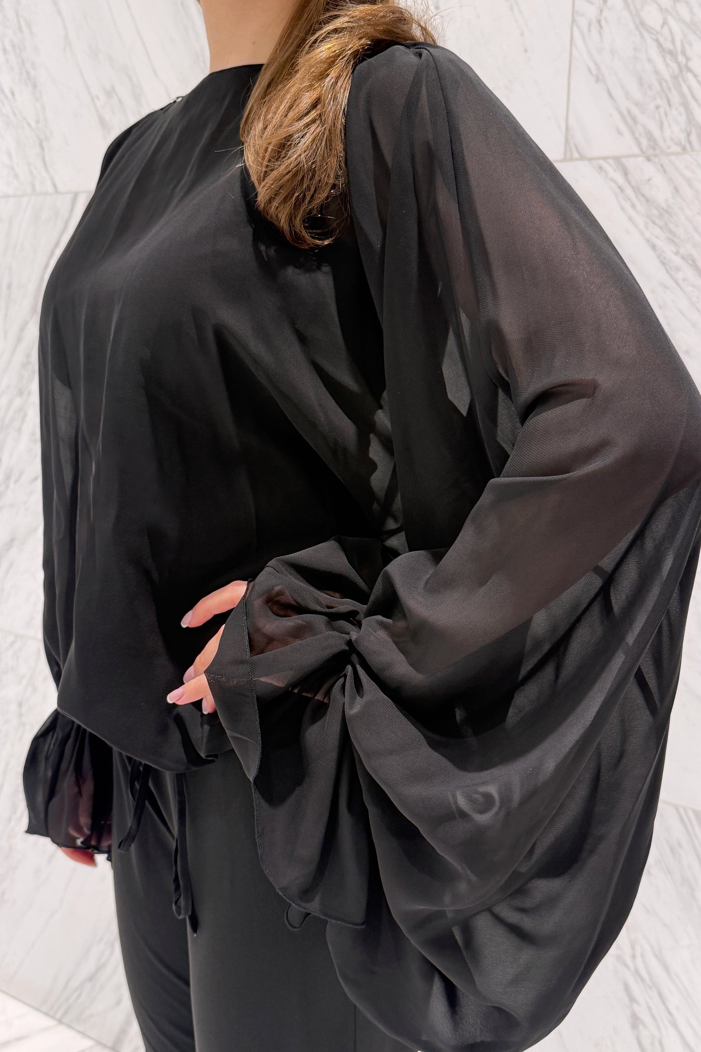 Chiffon blouse with a sewn top and voluminous sleeves