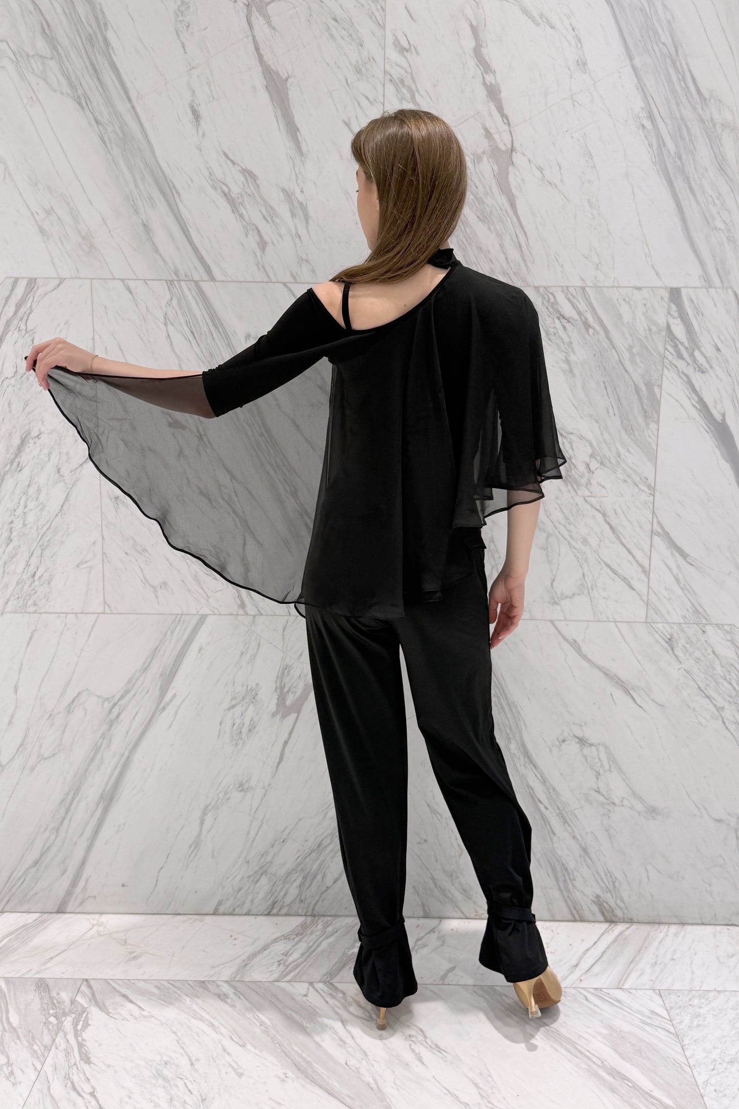 Top with a neck strap and chiffon elements