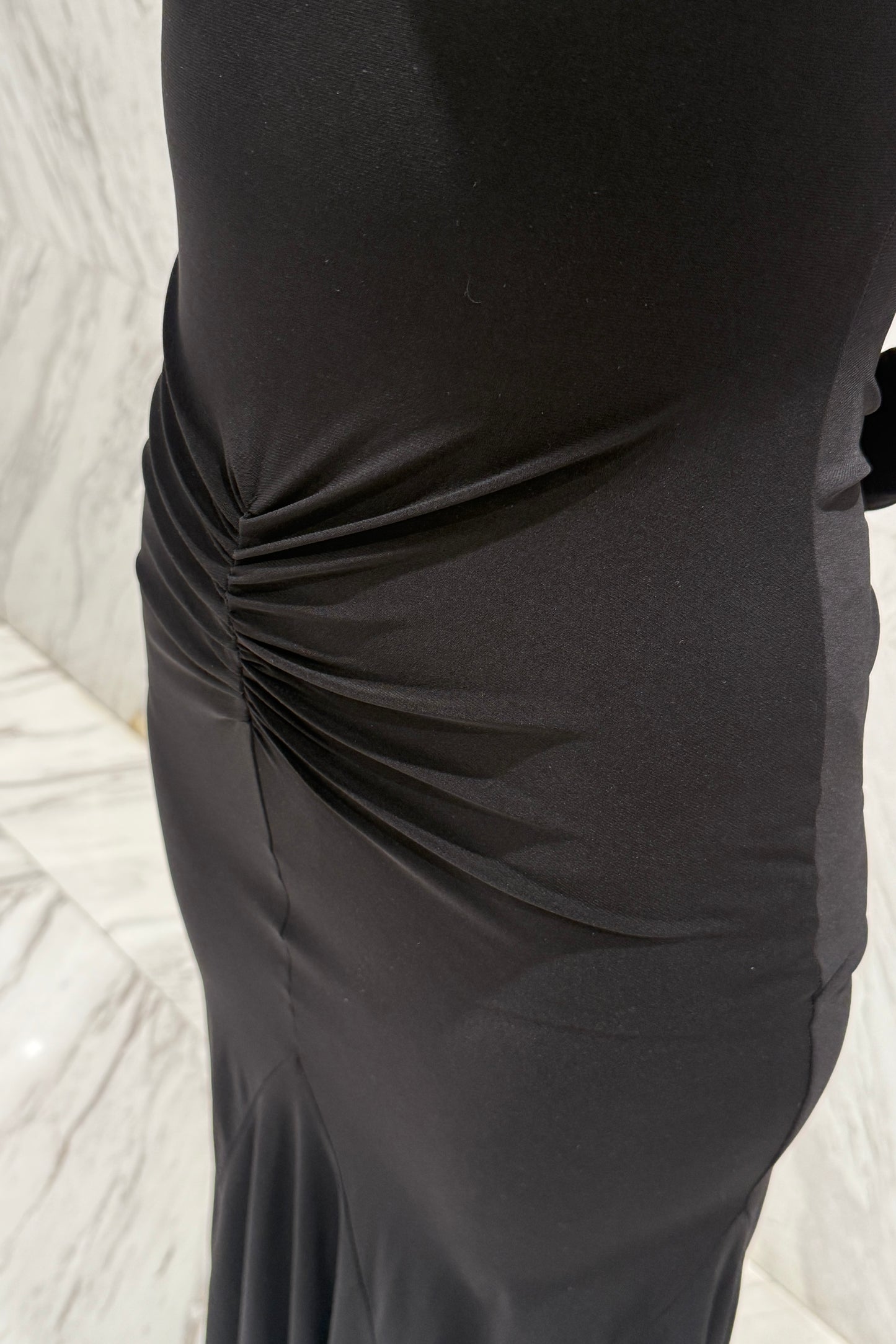 Black biflex ballroom dress with voluminous sleeves and an asymmetrical skirt