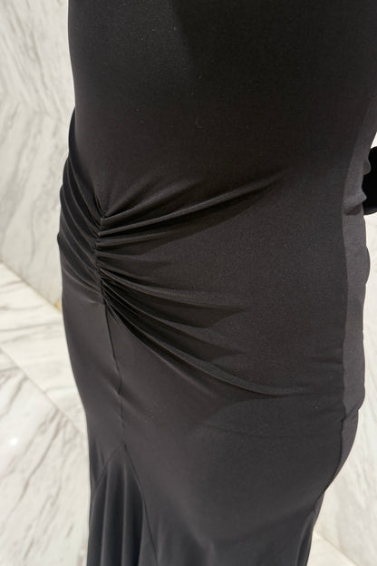 Black biflex ballroom dress with voluminous sleeves and an asymmetrical skirt