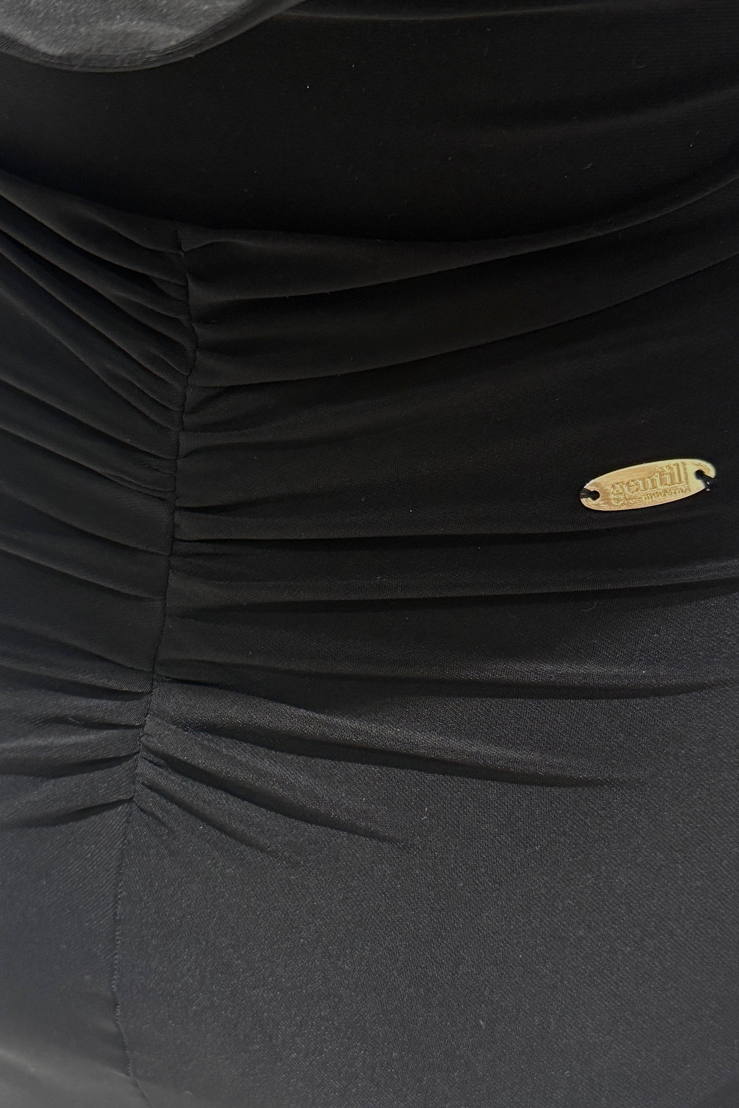 Black biflex ballroom dress with voluminous sleeves and an asymmetrical skirt