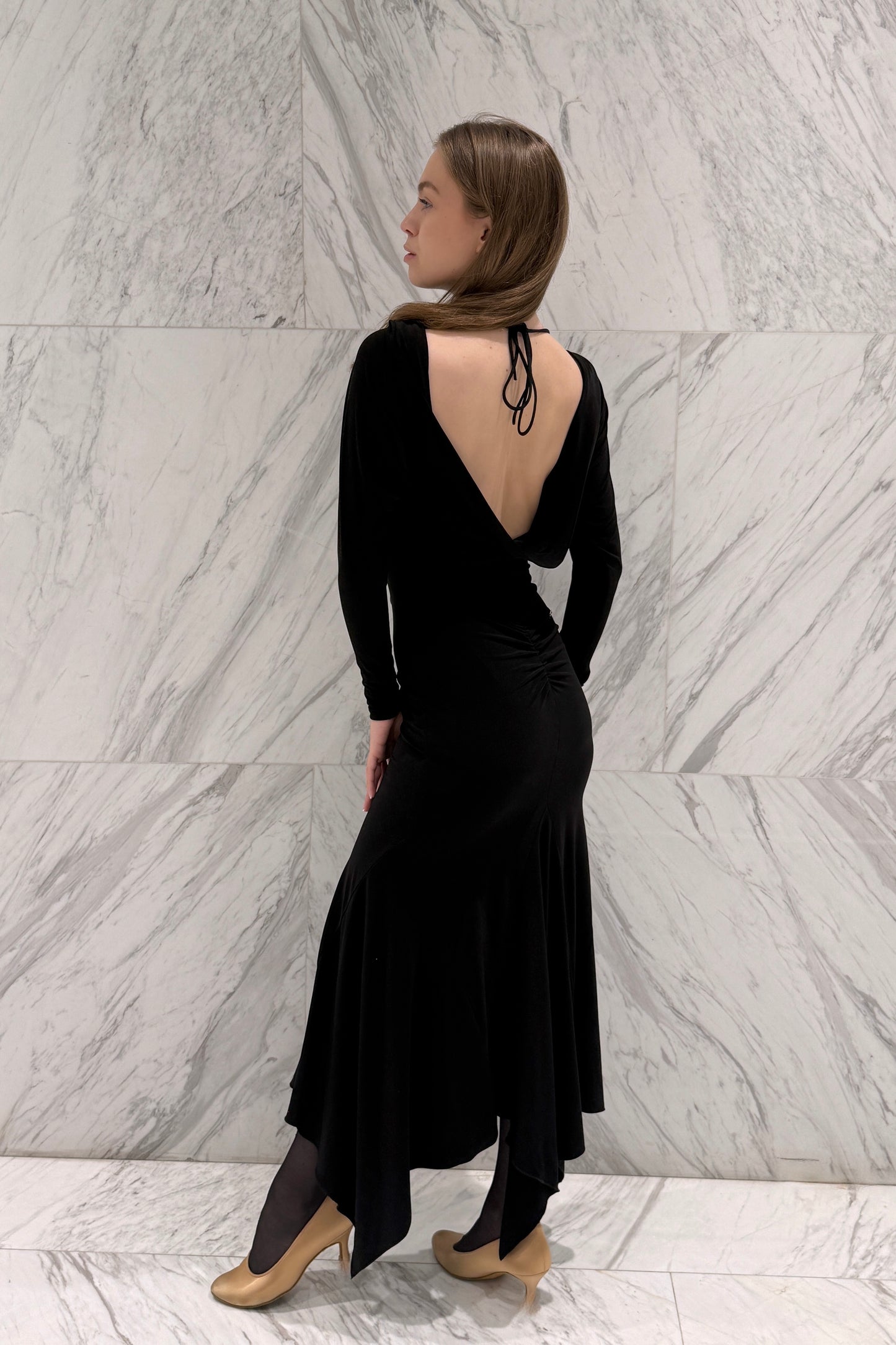 Black biflex ballroom dress with voluminous sleeves and an asymmetrical skirt