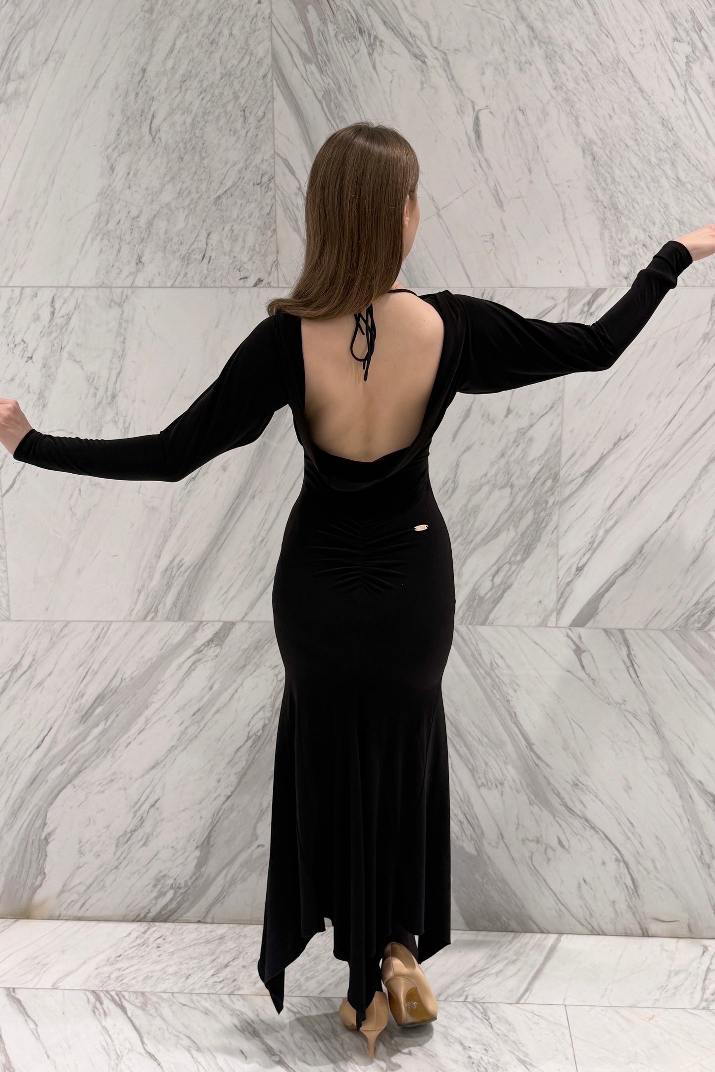 Black biflex ballroom dress with voluminous sleeves and an asymmetrical skirt