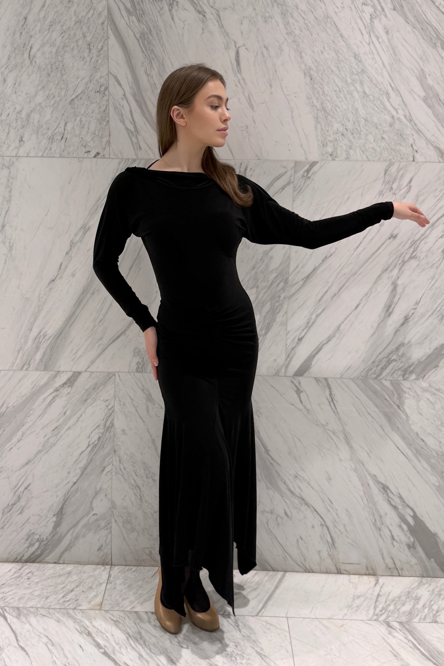 Black biflex ballroom dress with voluminous sleeves and an asymmetrical skirt